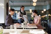 A couple is placing an order at Café Claire restaurant.